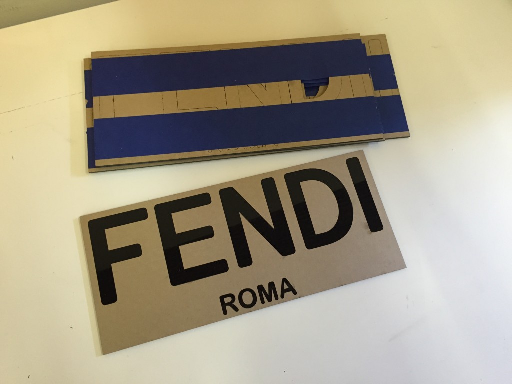 laser cut acrylic retail door sign for  fendi in nyc